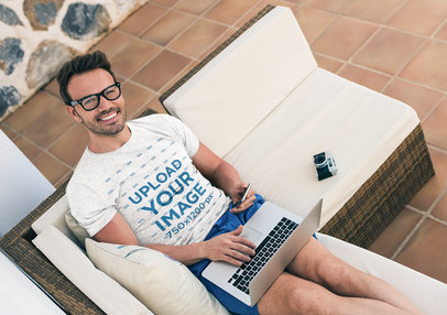 Heather T-Shirt Mockup of a Happy Man Working in His Living Room 40115-r-el2
