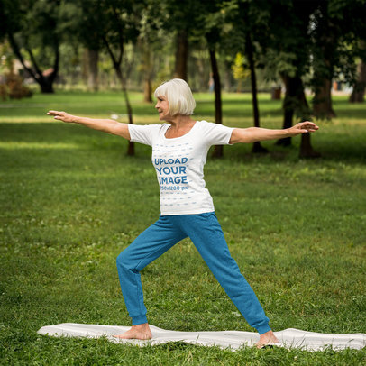 T-Shirt Mockup of an Elderly Woman Doing Yoga at a Park 46158-r-el2