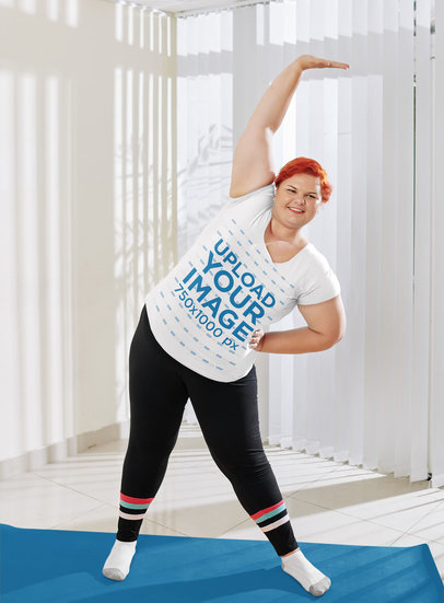 T-Shirt Mockup of a Woman with Red Hair Stretching at Home 45134-r-el2