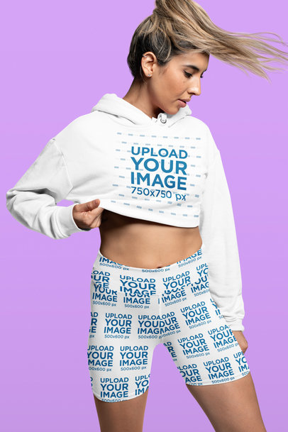 Crop Top Hoodie Mockup of a Woman Wearing Sublimated Biker Shorts at a Studio 42355a