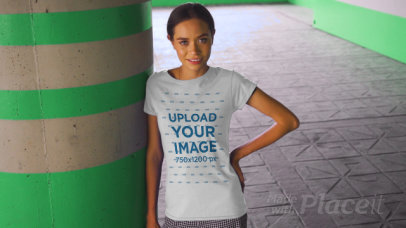 T-Shirt Video of a Happy Young Woman Posing by a Concrete Column 3383v