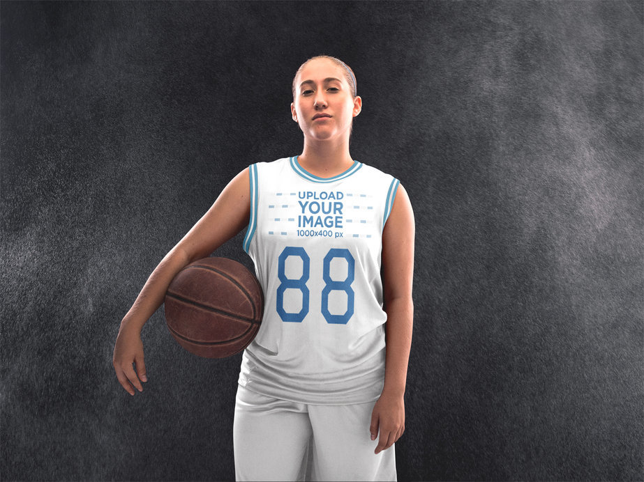 Placeit Basketball Jersey Maker Teenager Holding the Ball in Studio