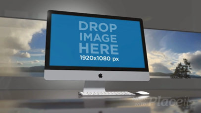 Video of an iMac Standing in an Office Room with a Landscape Image in the Back a15825b