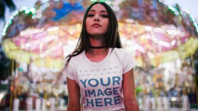 Beautiful Woman Wearing a Tshirt Cinemagraph with a Carousel Behind