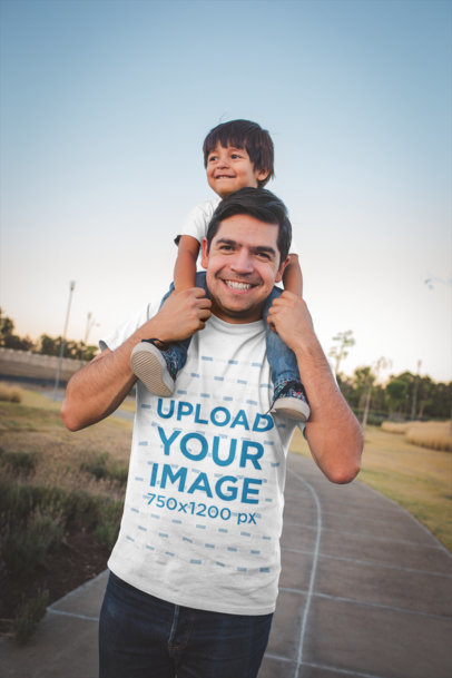 Download Placeit - Happy Dad Wearing a Camping T-Shirt Mockup Playing with his Daughter