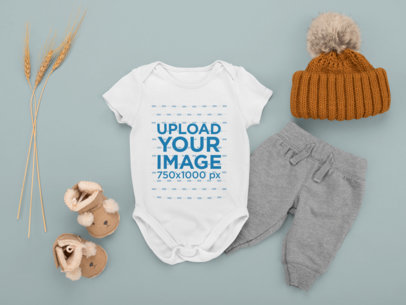 Onesie Mockup Featuring a Baby Boy's Outfit Placed on a Plain Background m1134